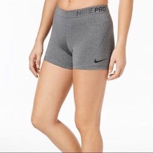 Grey nike pro dri-fit shorts.